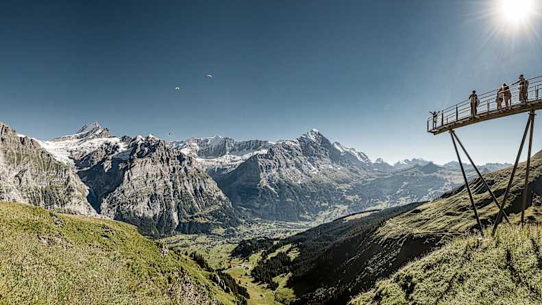 Grindelwald First Cliff Walk paragliders in the sky